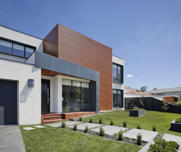 Elegant modern home with clean white facade